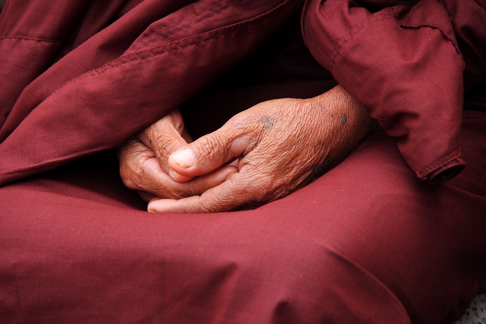 Hände eines Buddhisten